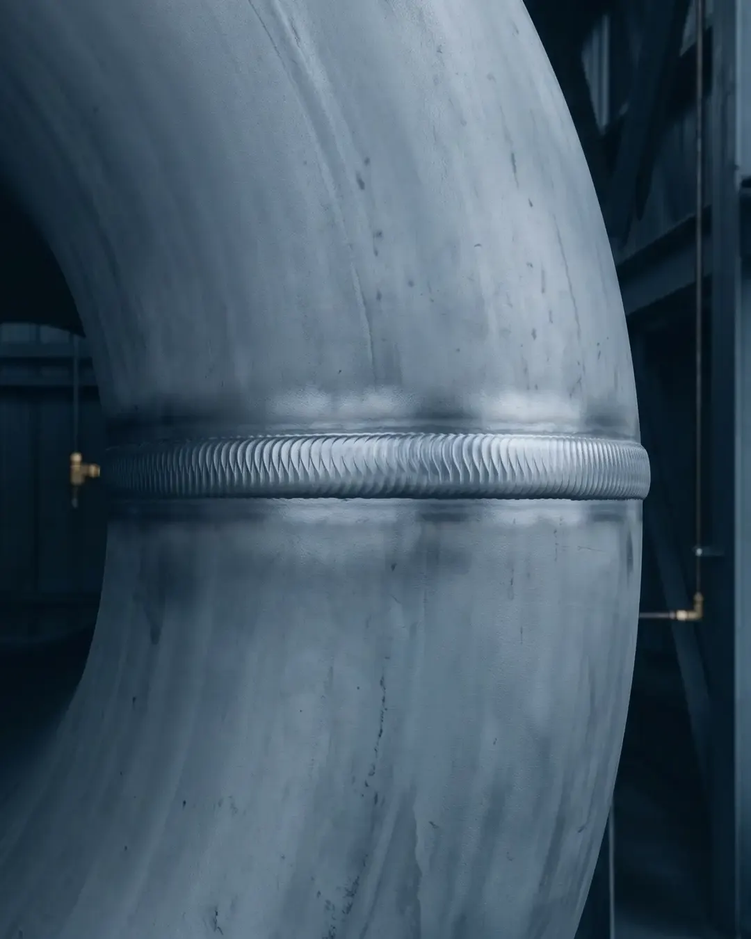 A circumferential girth weld banding a large-diameter pipe