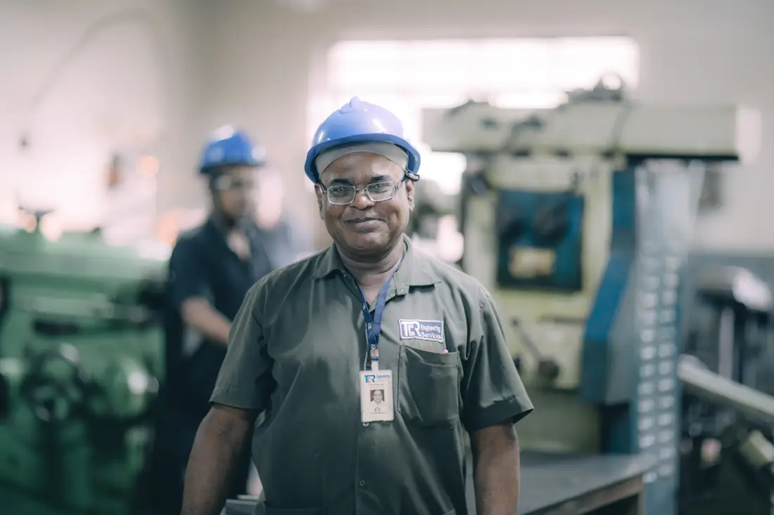 A TCR Engineering machinist setting up a test specimen on the shop floor at Mahape
